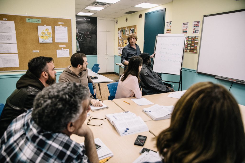 A group of adult learnings take a class as part of the Adult Learning Program