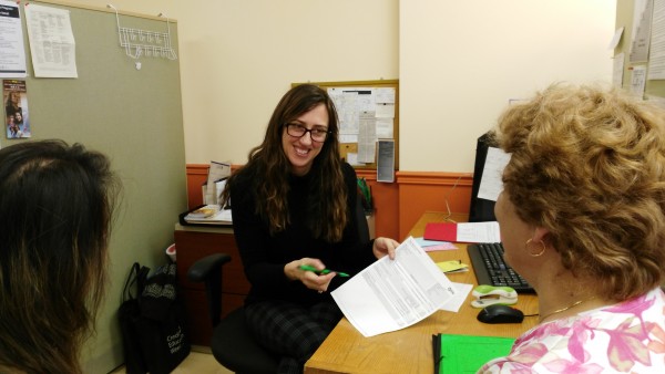 A FEPS staff member helps a participant