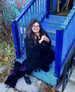 Photo of woman sitting on blue staircase