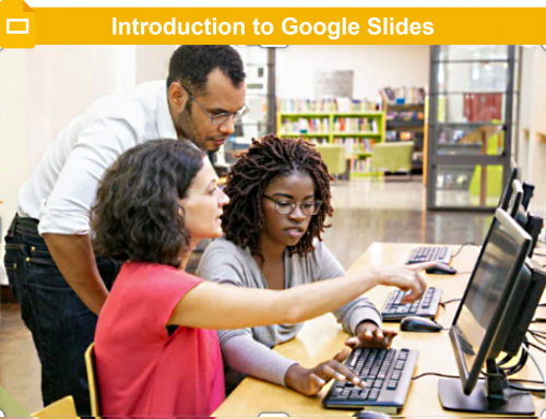 A label reading Introduction to Google Slides above a photo of 3 people around a computer.
