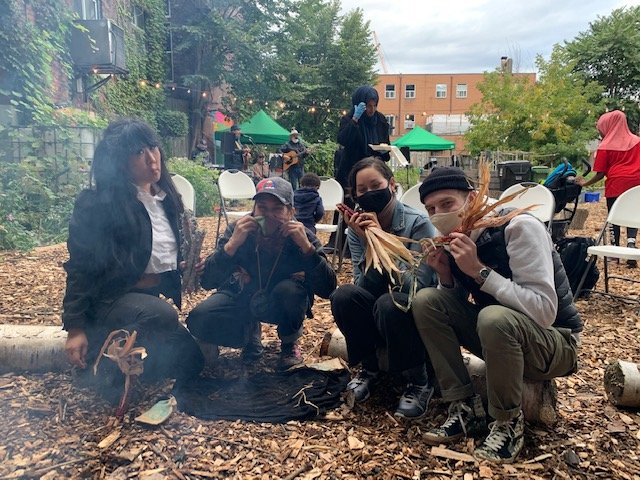 People holding up flowers
