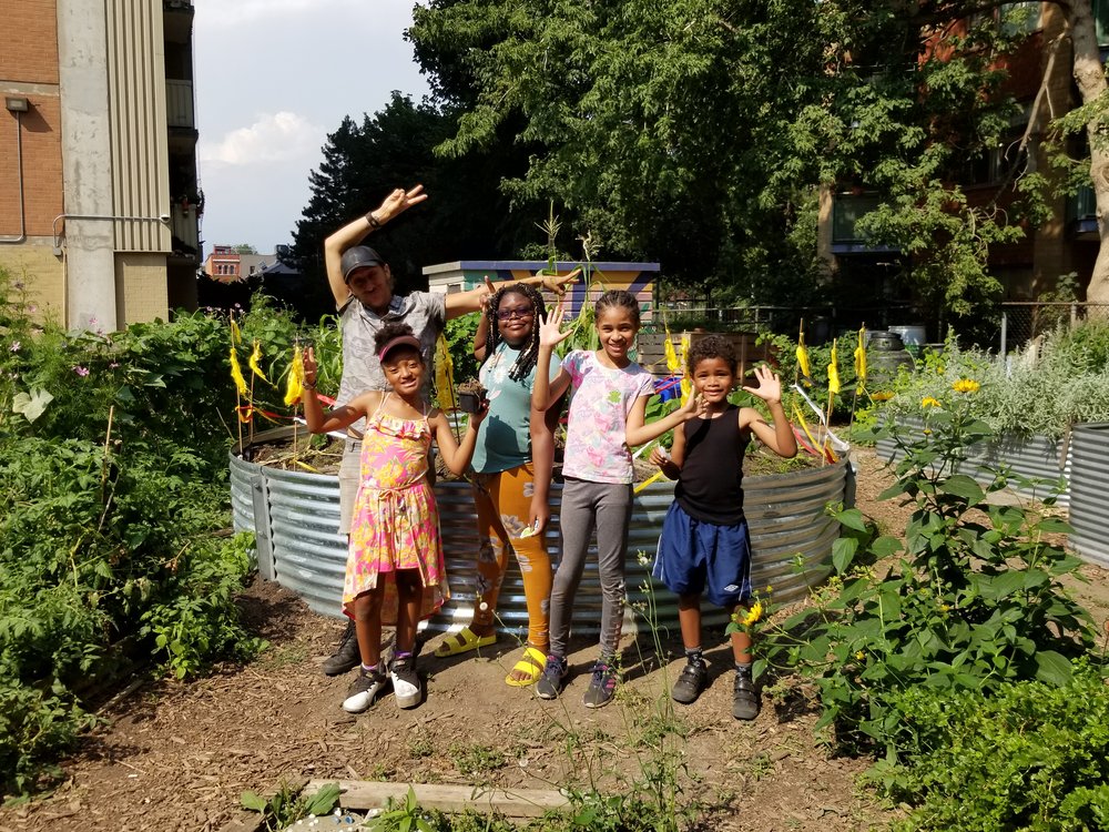 A group of children in a garden.