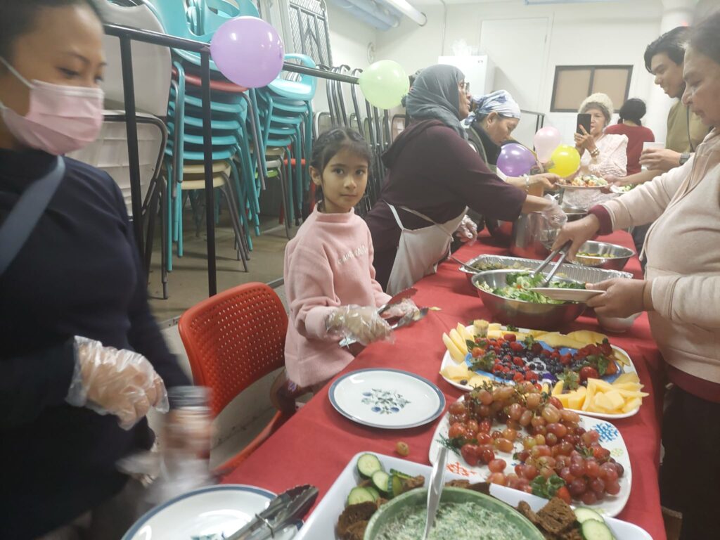 People serving food.