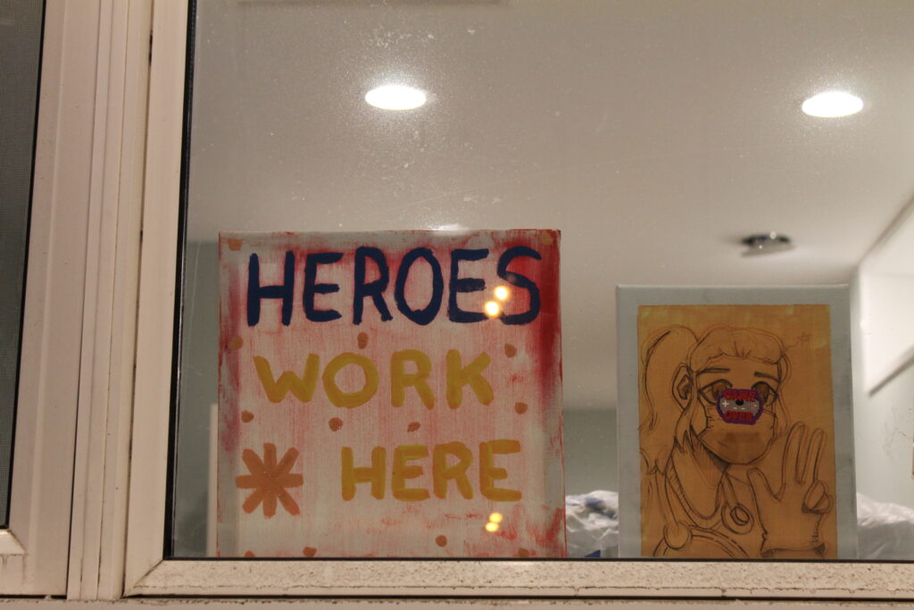 Painting that says Heroes Work Here
