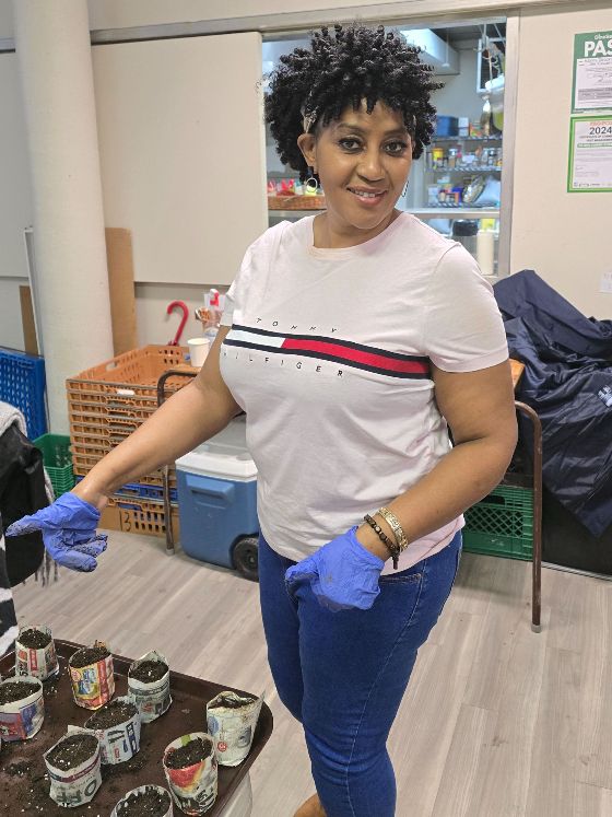 Woman with gloves doing garden work