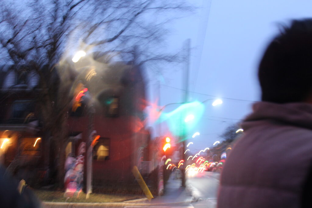A blurry photo of street lights.