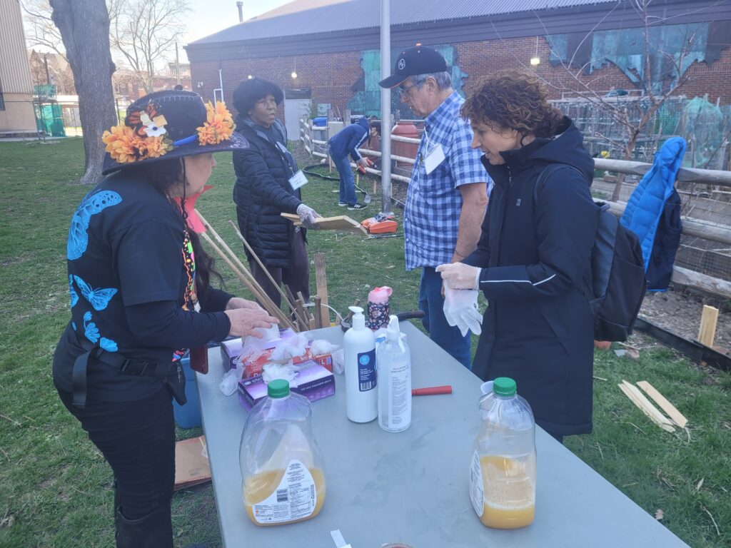 People standing around a table with supplies