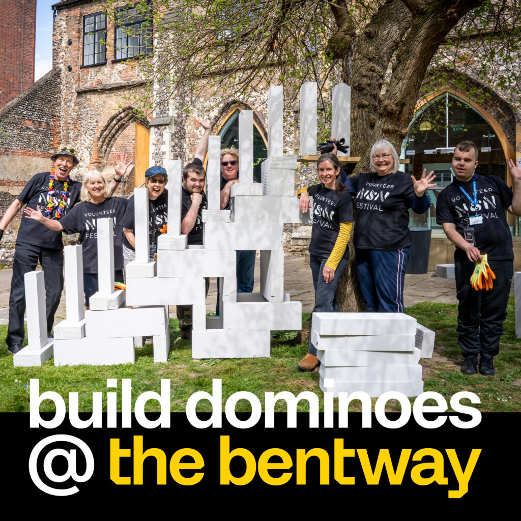 Group of people with giant dominoes